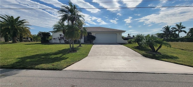 view of front of house with a front yard and a garage