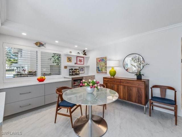 dining room featuring crown molding