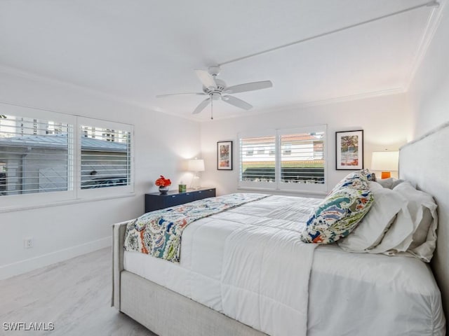 bedroom with ornamental molding, ceiling fan, and light hardwood / wood-style floors