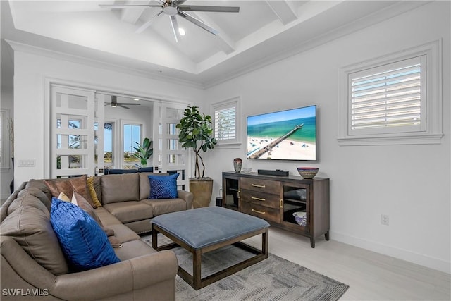 living room featuring lofted ceiling with beams, a ceiling fan, and baseboards