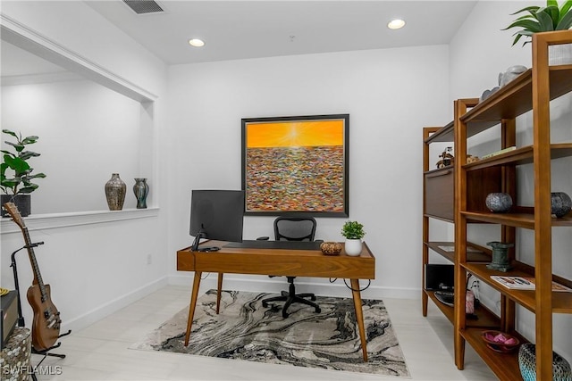 home office with recessed lighting, visible vents, and baseboards