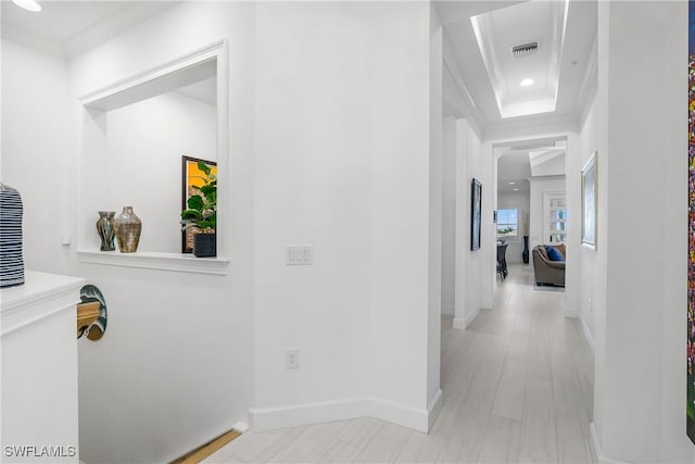 corridor featuring recessed lighting, visible vents, baseboards, and ornamental molding