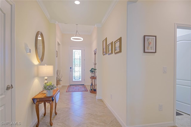 foyer entrance featuring crown molding and light tile patterned floors