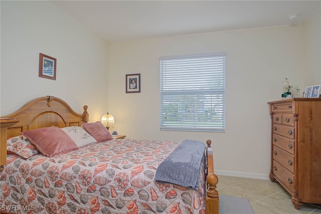 bedroom featuring light tile patterned floors