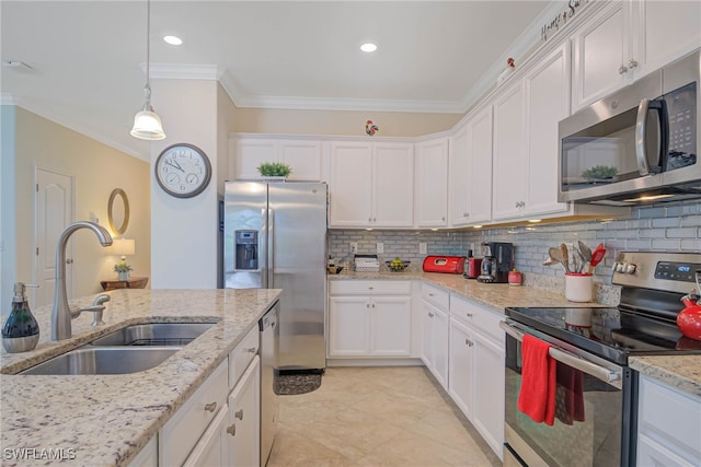 kitchen featuring white cabinets, decorative backsplash, sink, and stainless steel appliances