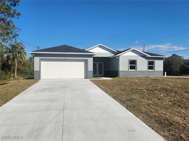 ranch-style house with a front lawn and a garage