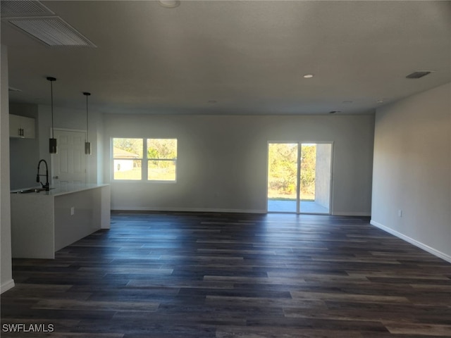 spare room featuring dark hardwood / wood-style flooring and sink