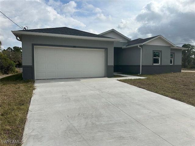 ranch-style house featuring a garage