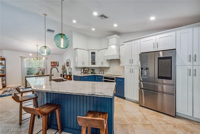 kitchen featuring white cabinetry, sink, hanging light fixtures, stainless steel fridge with ice dispenser, and blue cabinets