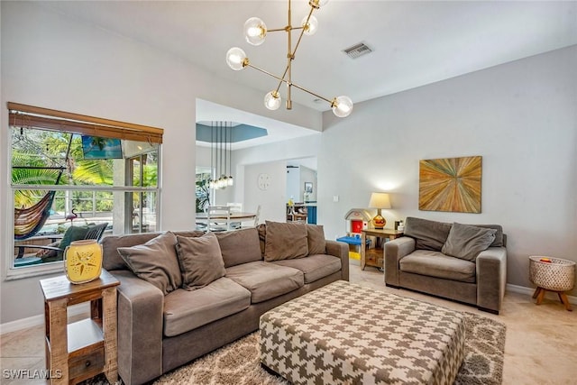 tiled living room with a chandelier