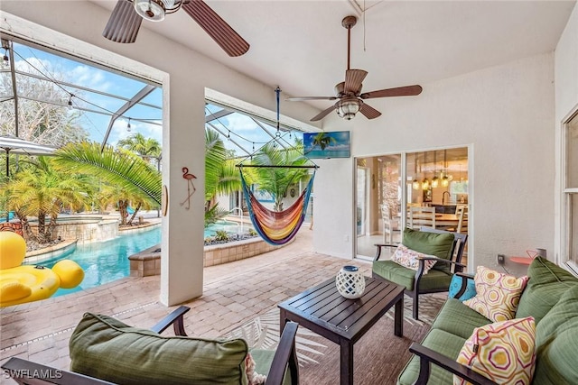 sunroom featuring ceiling fan