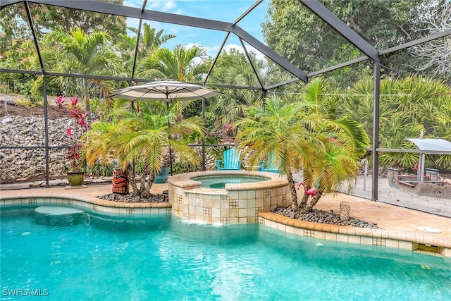 view of pool with a lanai, a patio area, and an in ground hot tub