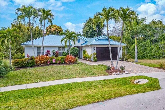 ranch-style house with a front lawn and a garage