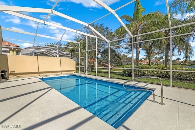 pool with a lanai and a patio