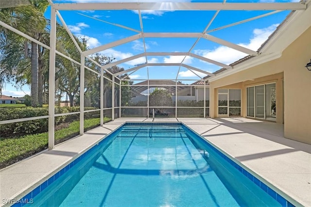 pool with a patio area and a lanai