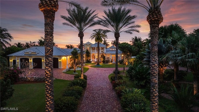 view of front of property with a lawn