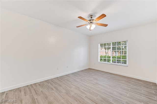 empty room featuring ceiling fan and light wood-type flooring