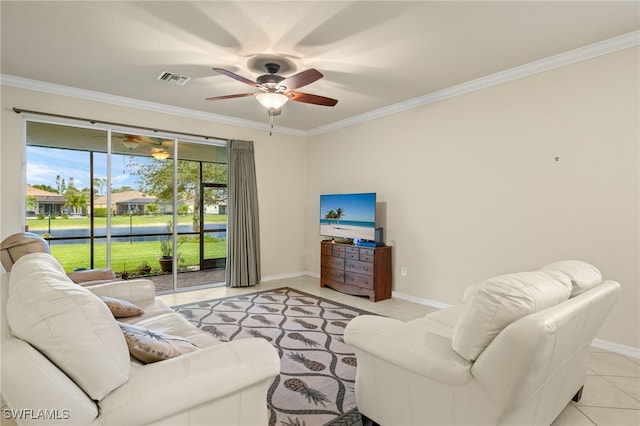 tiled living room with ceiling fan and ornamental molding