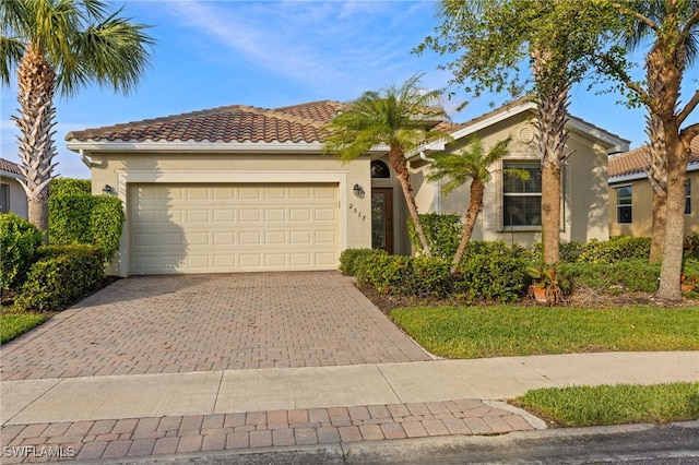 2517 Laurentina Ln, Cape Coral, FL 33909 - mediterranean / spanish-style house with a garage