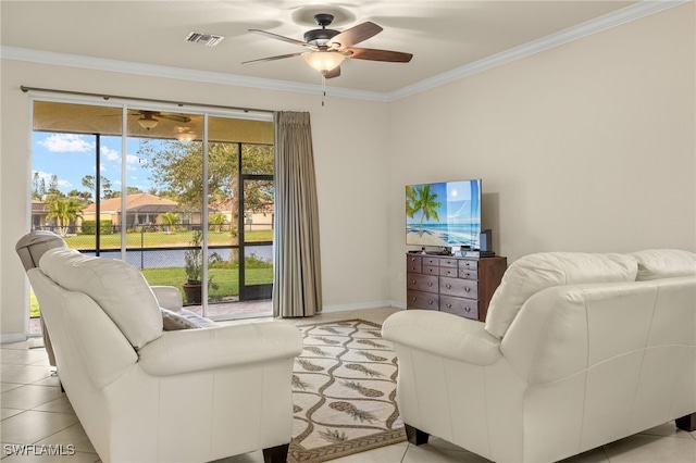 tiled living room with ceiling fan and ornamental molding