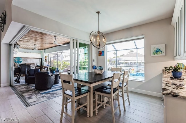 dining area featuring an inviting chandelier