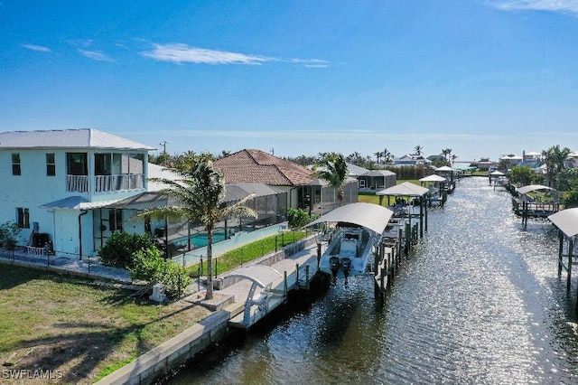 view of dock featuring a water view and glass enclosure