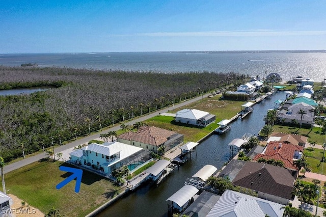 birds eye view of property featuring a water view