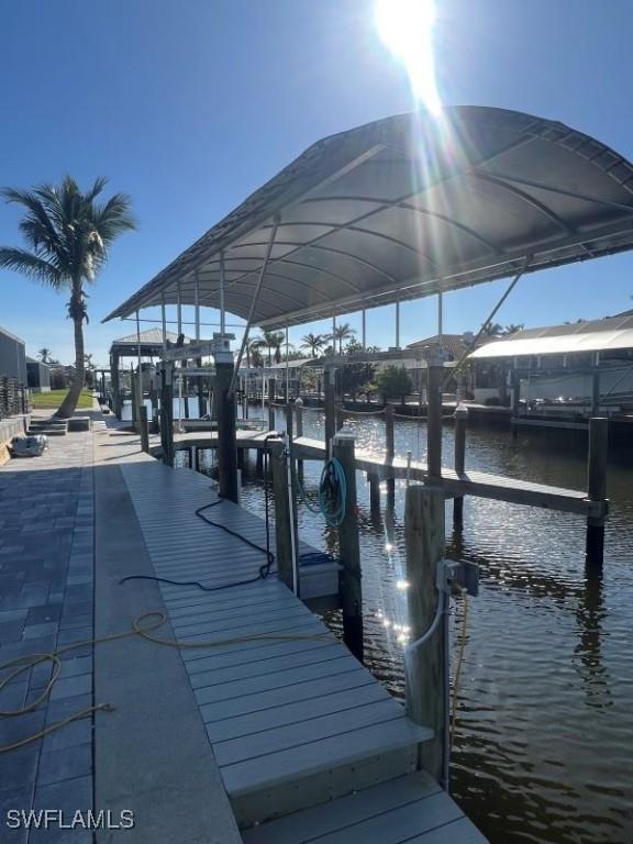 dock area featuring a water view