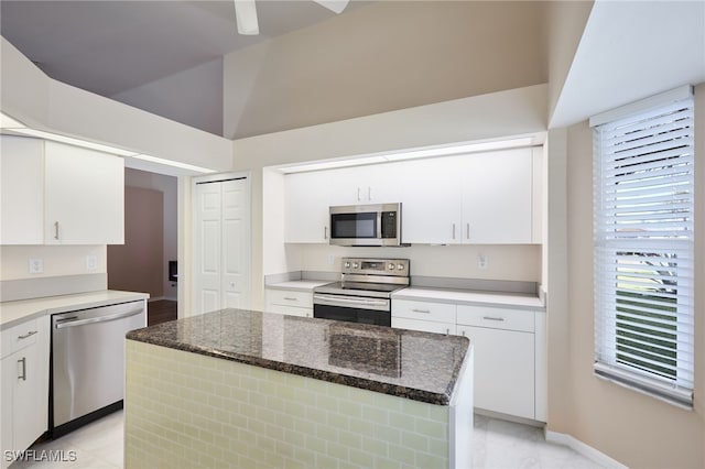 kitchen featuring a kitchen island, white cabinetry, and stainless steel appliances