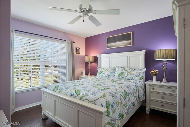 bedroom with ceiling fan and dark wood-type flooring