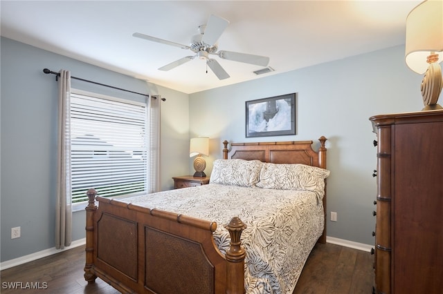 bedroom with ceiling fan and dark hardwood / wood-style flooring