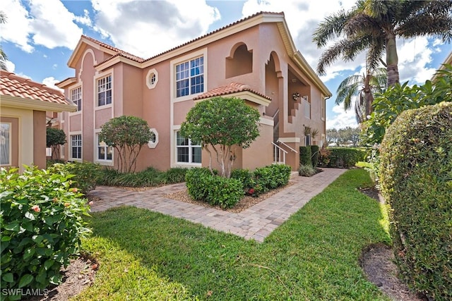 view of side of property with a yard