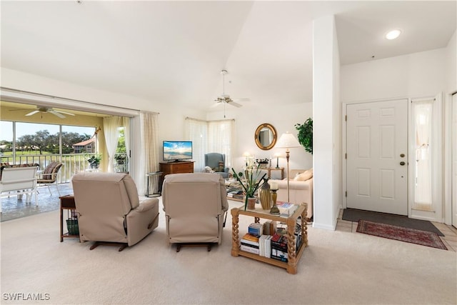 living room featuring light carpet and ceiling fan