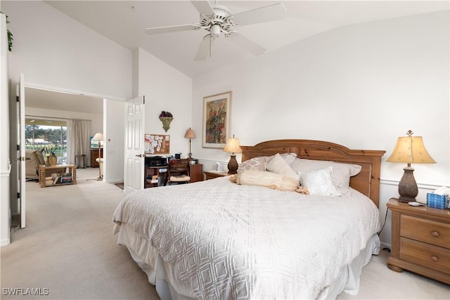 carpeted bedroom with ceiling fan and lofted ceiling