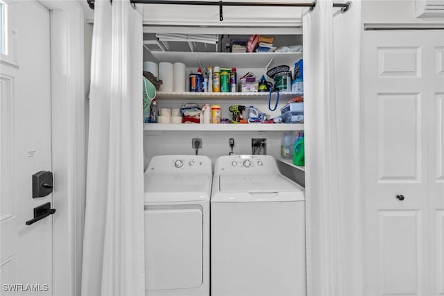 laundry area with washing machine and clothes dryer