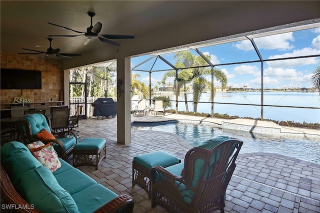 view of patio / terrace with an outdoor living space, an outdoor pool, a grill, and a water view