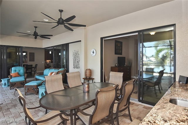 dining space featuring ceiling fan