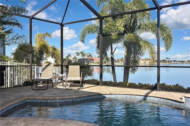 view of pool with a patio area, a lanai, and a water view