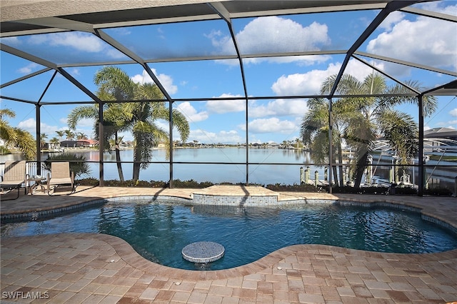 view of pool with a lanai, a water view, and a patio