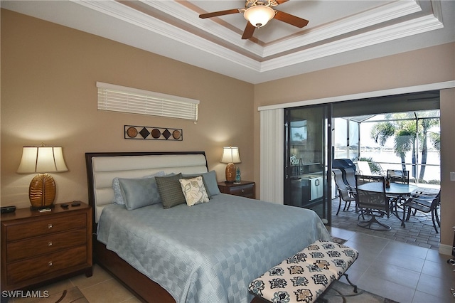 tiled bedroom featuring a ceiling fan, access to outside, a raised ceiling, and crown molding