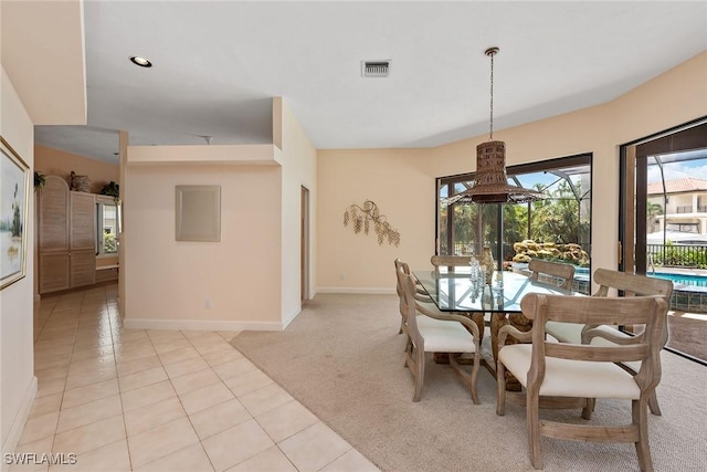 dining room with light carpet