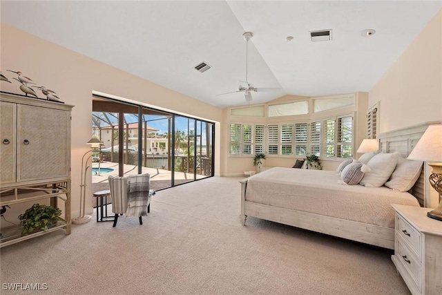 carpeted bedroom featuring access to outside, multiple windows, lofted ceiling, and ceiling fan