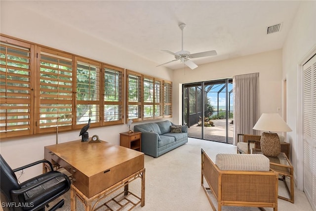 sunroom with ceiling fan