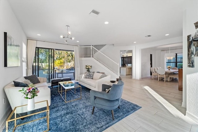 living room with an inviting chandelier