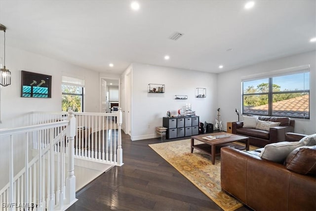 living room featuring dark wood-type flooring