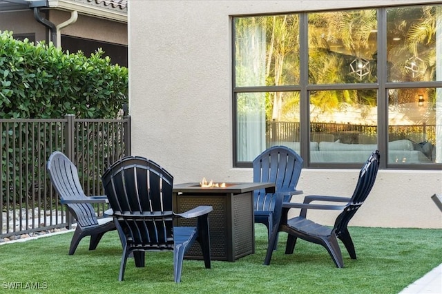 view of patio / terrace featuring an outdoor fire pit