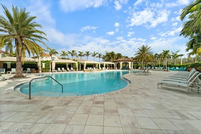 view of swimming pool with a gazebo and a patio