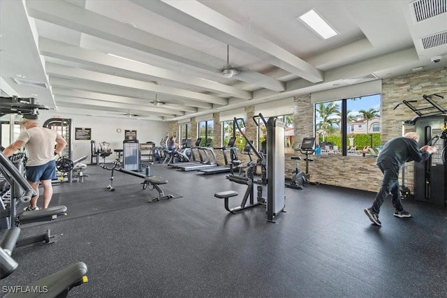 exercise room with ceiling fan and a wealth of natural light