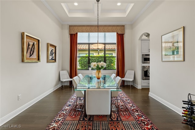 dining room with crown molding and dark wood-type flooring