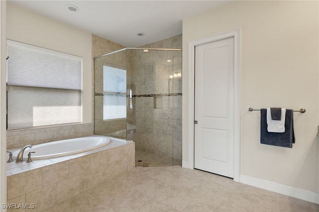 bathroom with tile patterned flooring and plus walk in shower